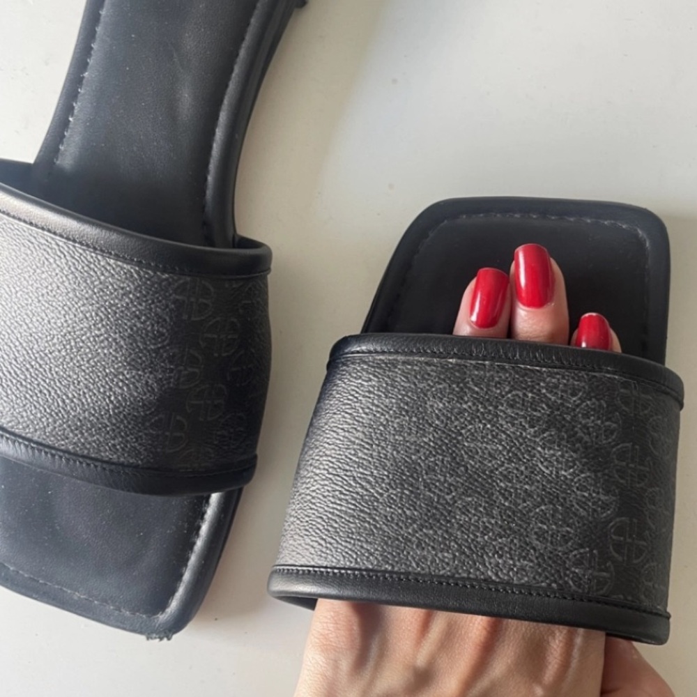 Anine Bing - Ria Slides in Black Monogram Print
Anine Bing